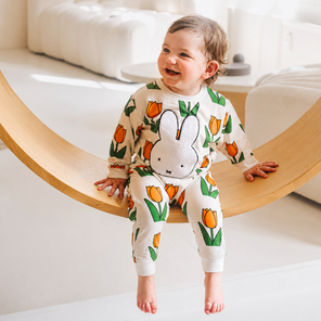 Child wearing the Miffy in the Meadow tulip print bamboo lounge set